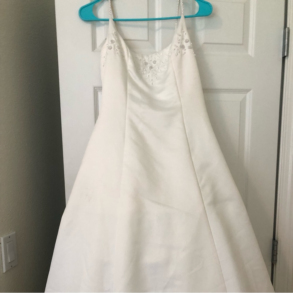 thrifted wedding dress with a few stains